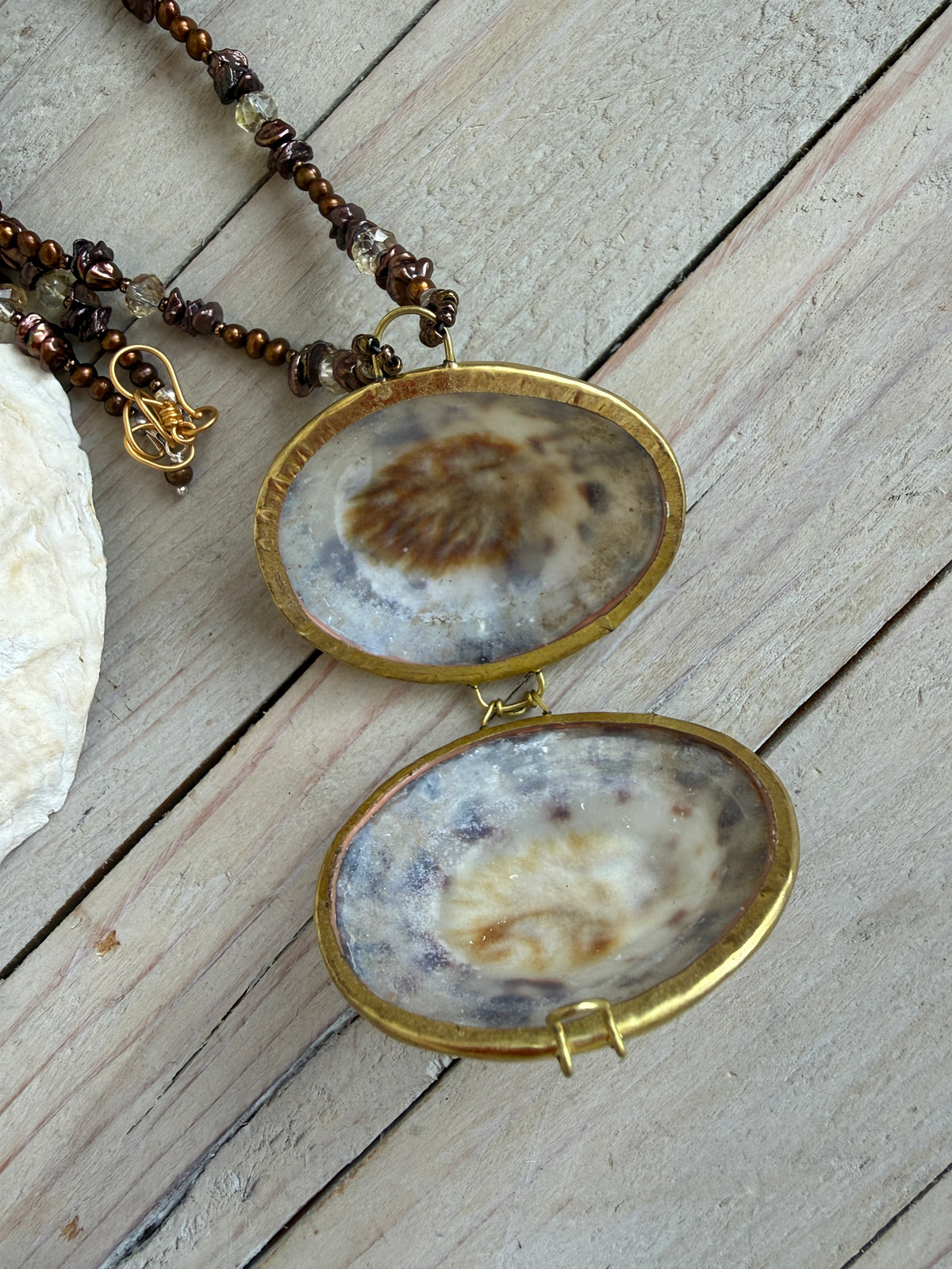 Shell “purse” on brown pearls and Czech glass necklace.