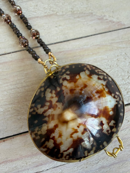 Limpet shell “purse” with chocolate pyrite, pearls, and Czech glass necklace. 