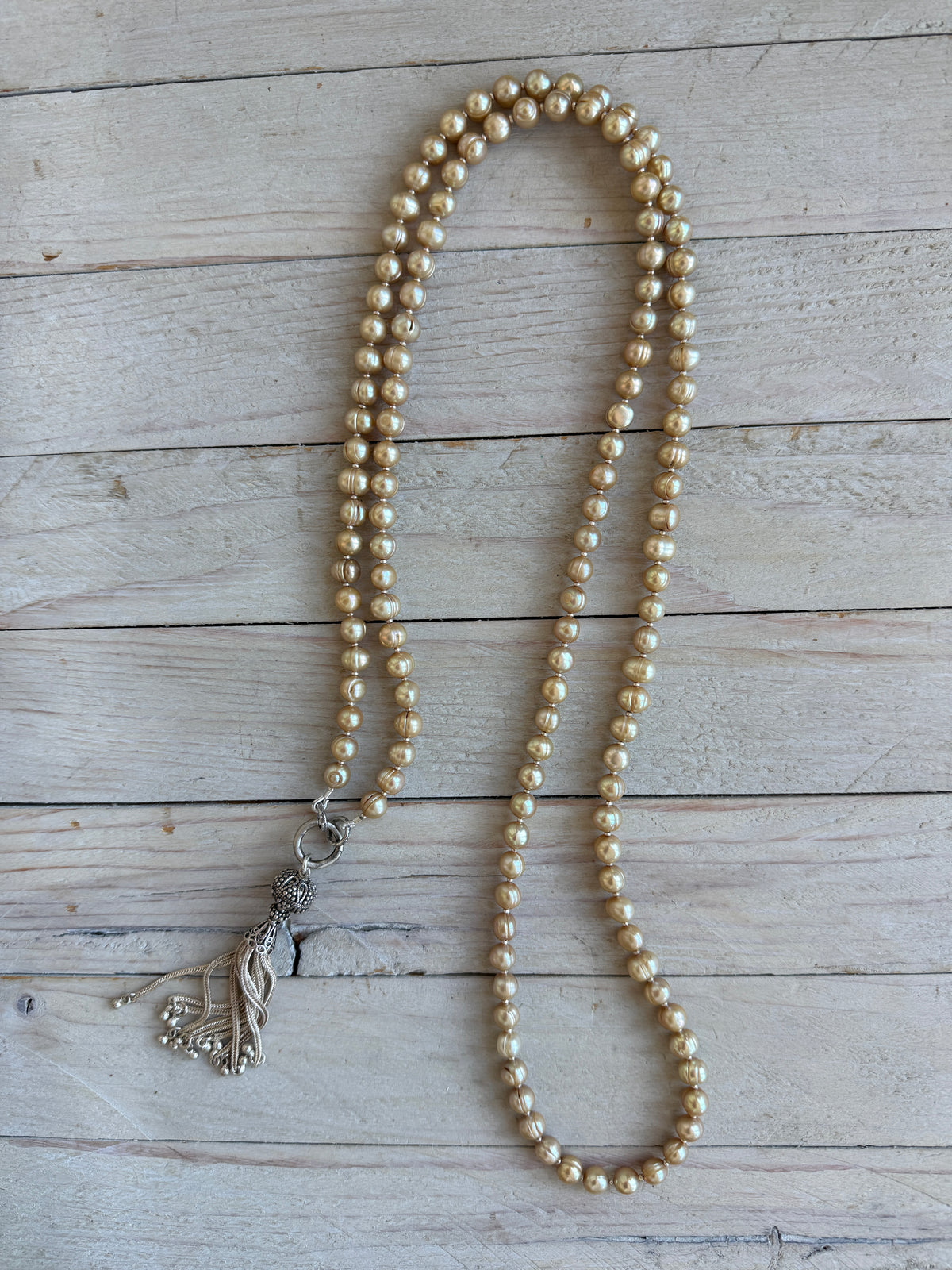 Champagne pearls with fine silver spacers and removable sterling tassel necklace.