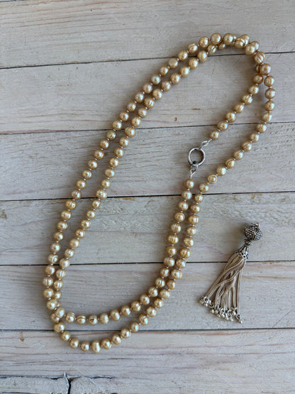 Champagne pearls with fine silver spacers and removable sterling tassel necklace.