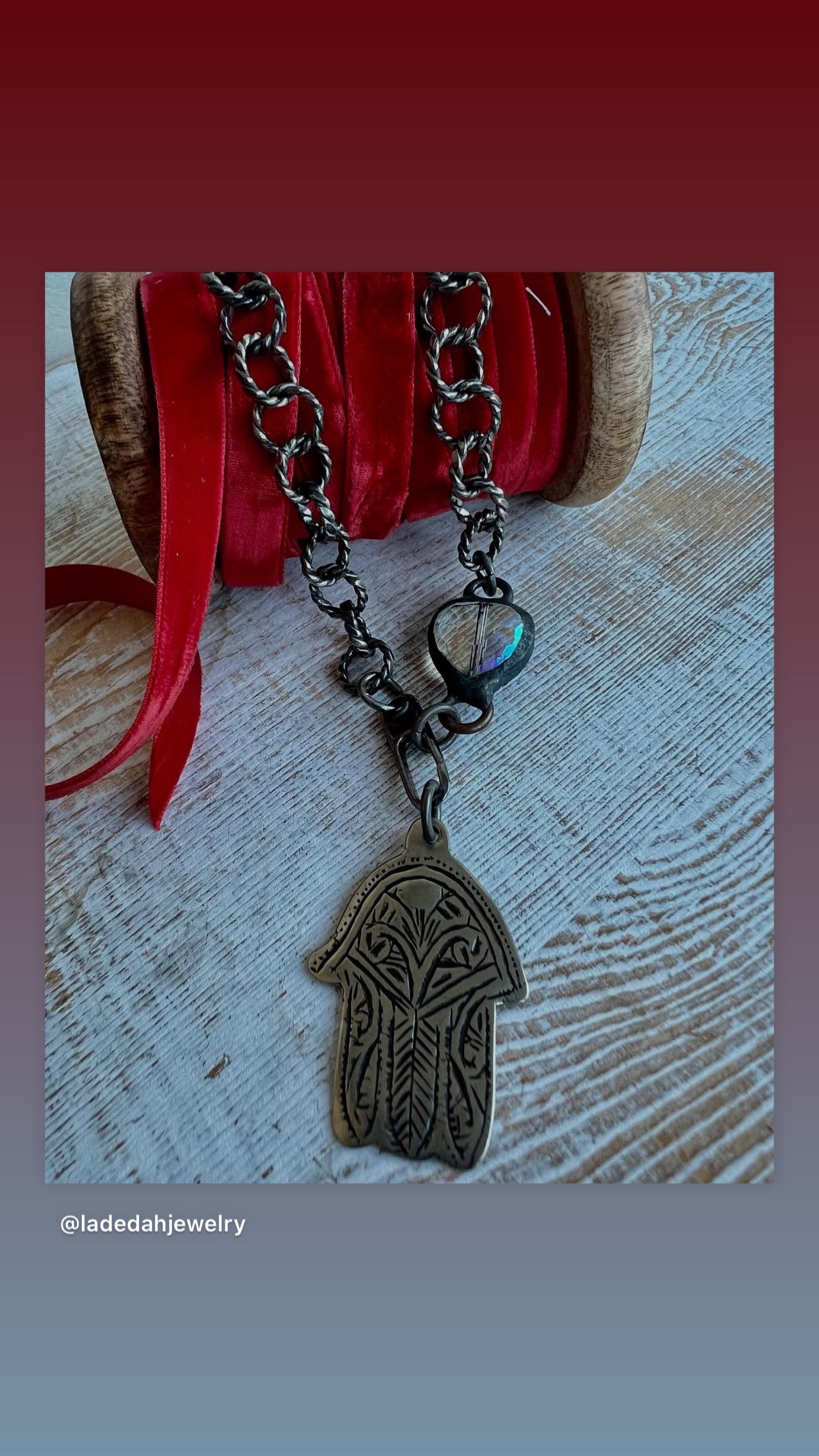 Chunky oxidized sterling rope chain with a crystal hear, sterling carabiner clasp, and stamped bronze hamsa pendant. 18”