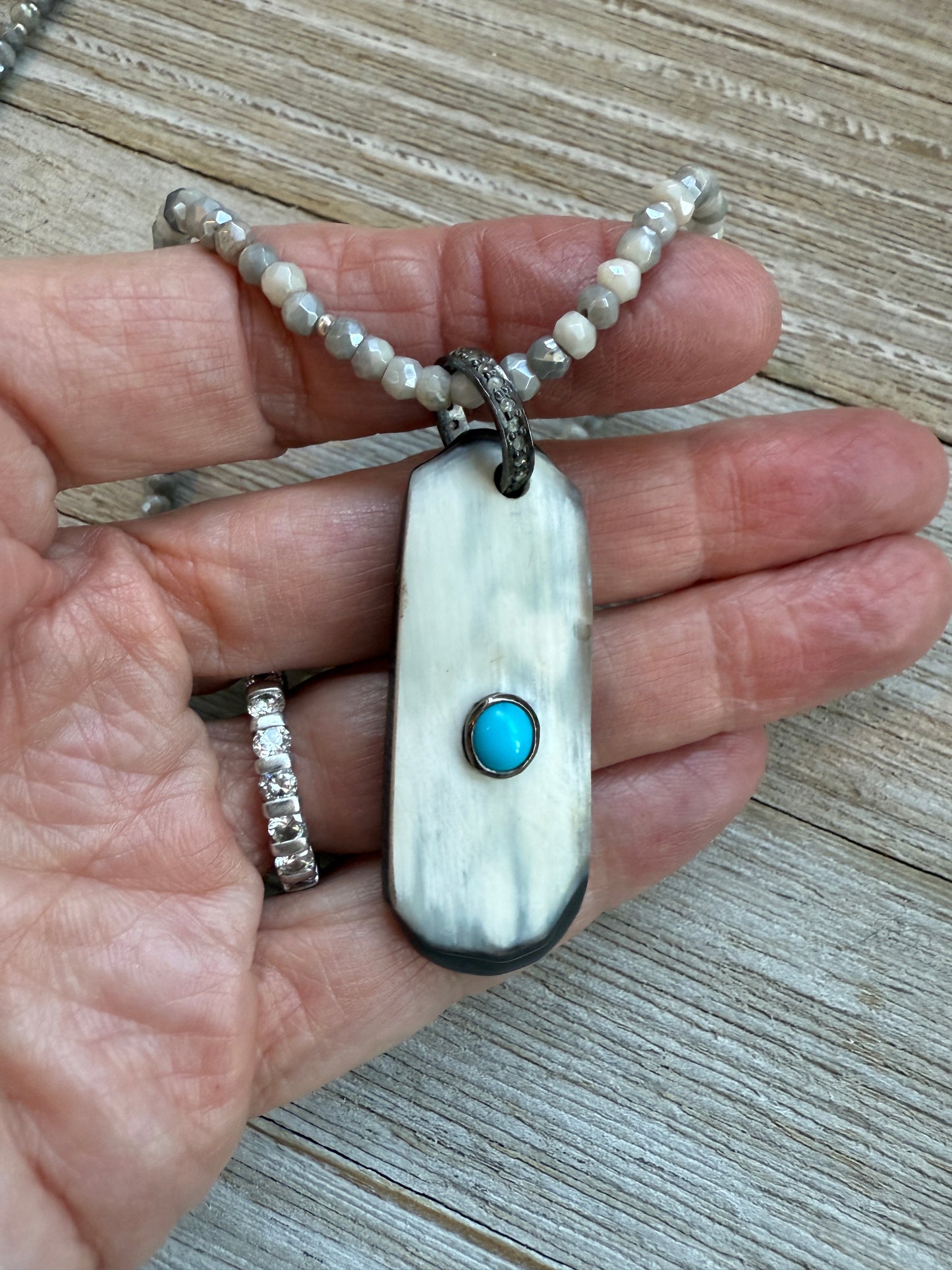 Creamy grey bone pendant with turquoise inlay and diamond bale on silverite and fine silver adjustable necklace.