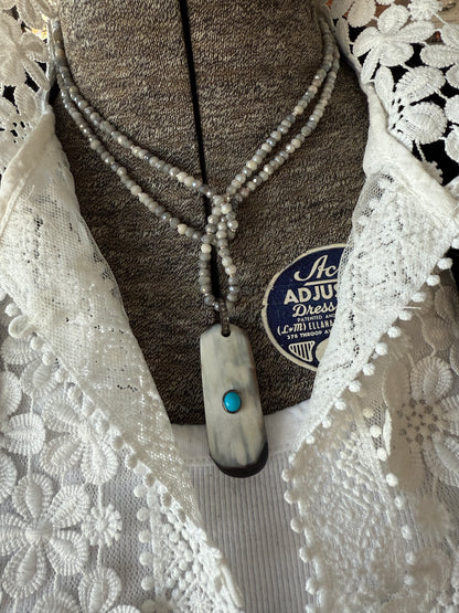 Creamy grey bone pendant with turquoise inlay and diamond bale on silverite and fine silver adjustable necklace.