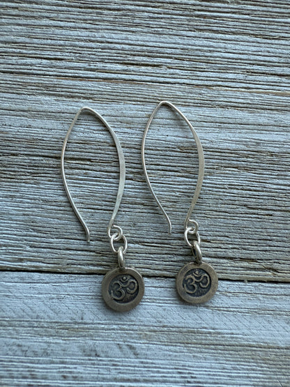 Fine silver ohm earrings on fine silver wires.