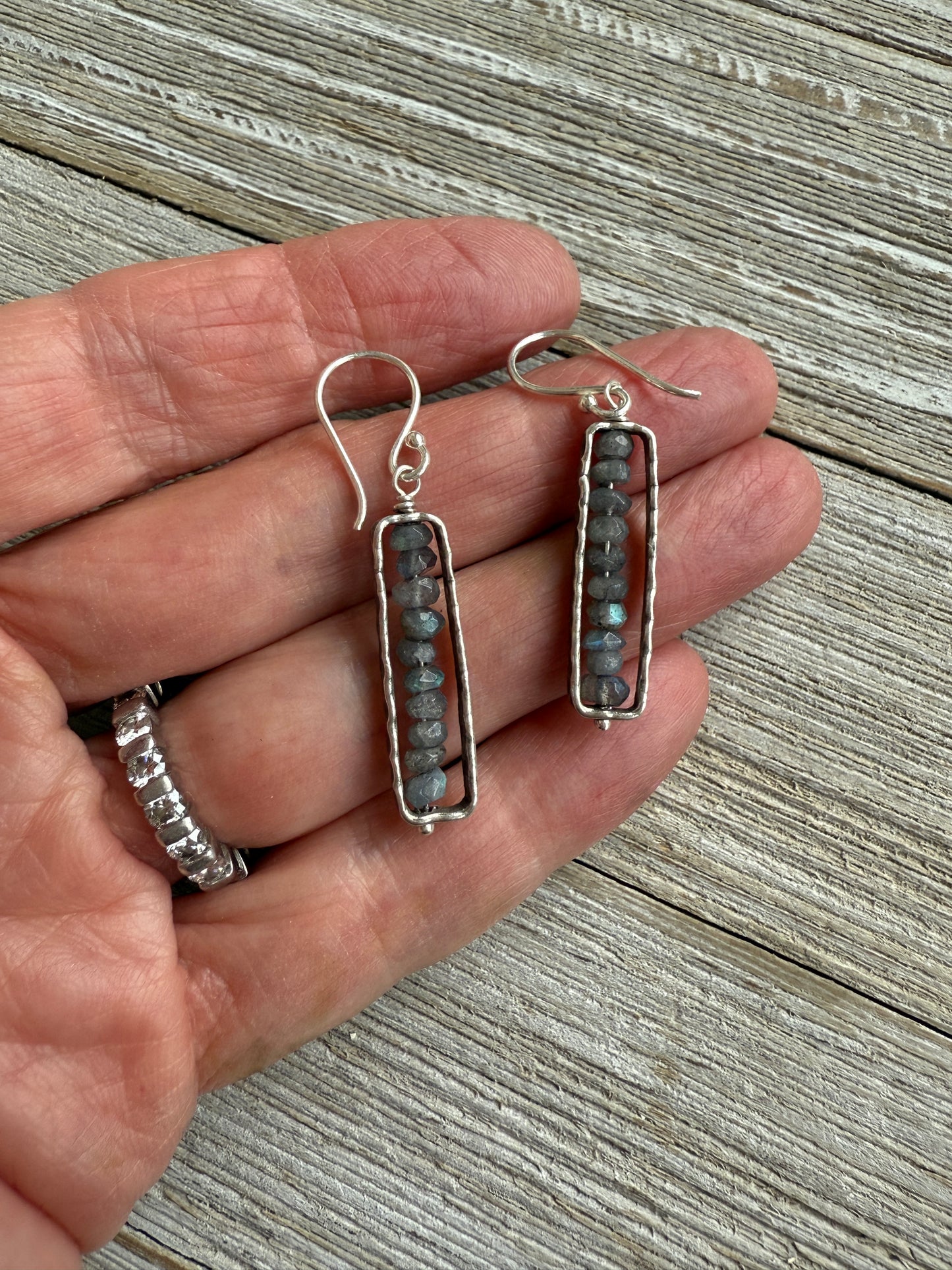 Labradorite in fine silver frames on fine silver ear wires. Earrings.