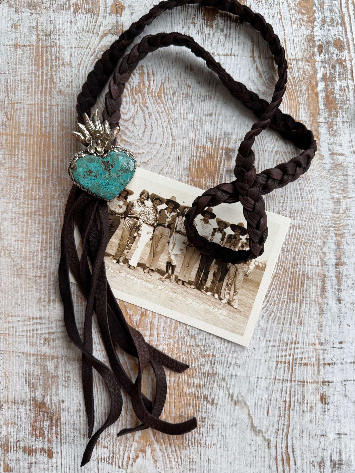 Tibetan turquoise heart on braided deerskin leather necklace. 32”.