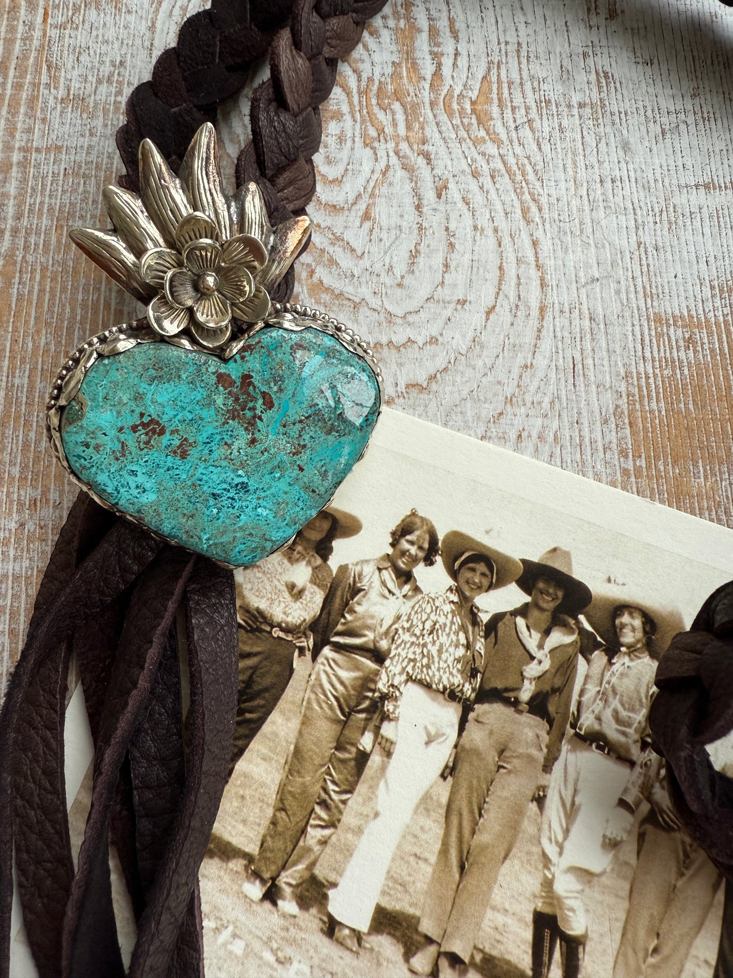 Tibetan turquoise heart on braided deerskin leather necklace. 32”.