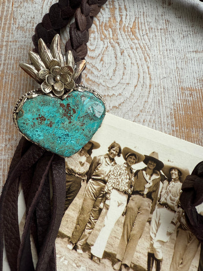 Tibetan turquoise heart on braided deerskin leather necklace. 32”.