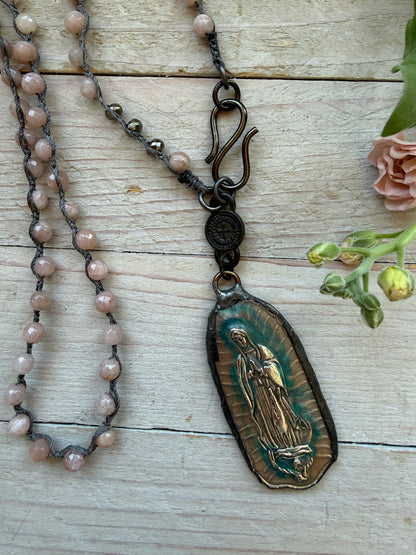 Our Lady of Guadeloupe pendant on knotted sunstone necklace.