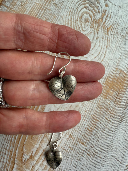 Heart shaped leaf earrings of fine silver.