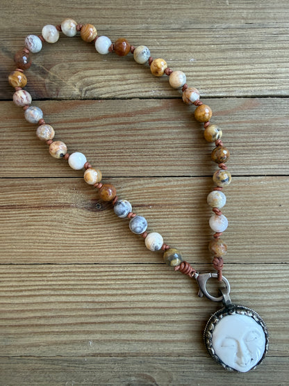 Crazy lace agates knotted on leather necklace with full moon pendant.