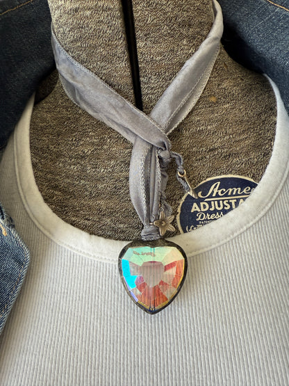 Prism heart on pale blue silk ribbon with fine silver flower charms. 36”.