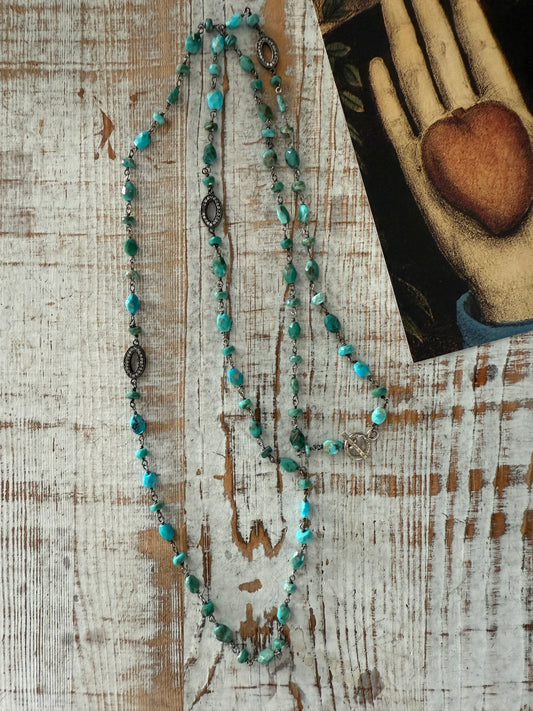 Wire wrapped turquoise chain necklace with topaz accents and toggle clasp. 35”