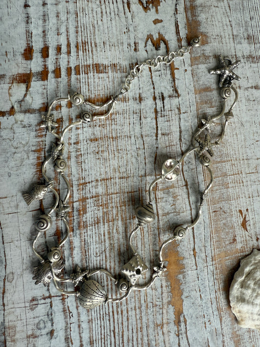 Two strand seashell and sealife fine silver necklace. Adjustable 17-30”.