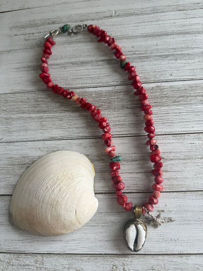 Tibetan cowrie shell pendant on coral necklace. 17.5-18.5”