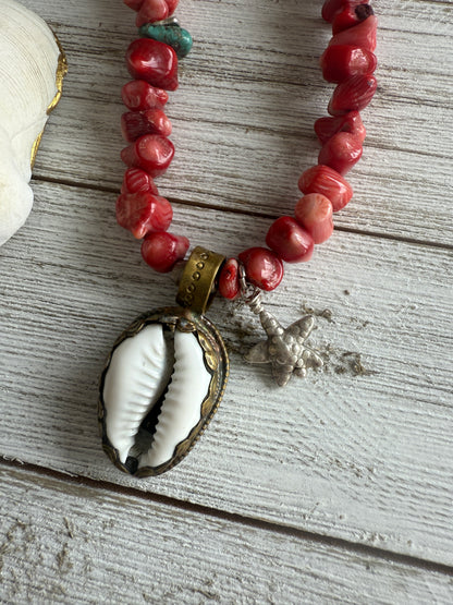 Tibetan cowrie shell pendant on coral necklace. 17.5-18.5”