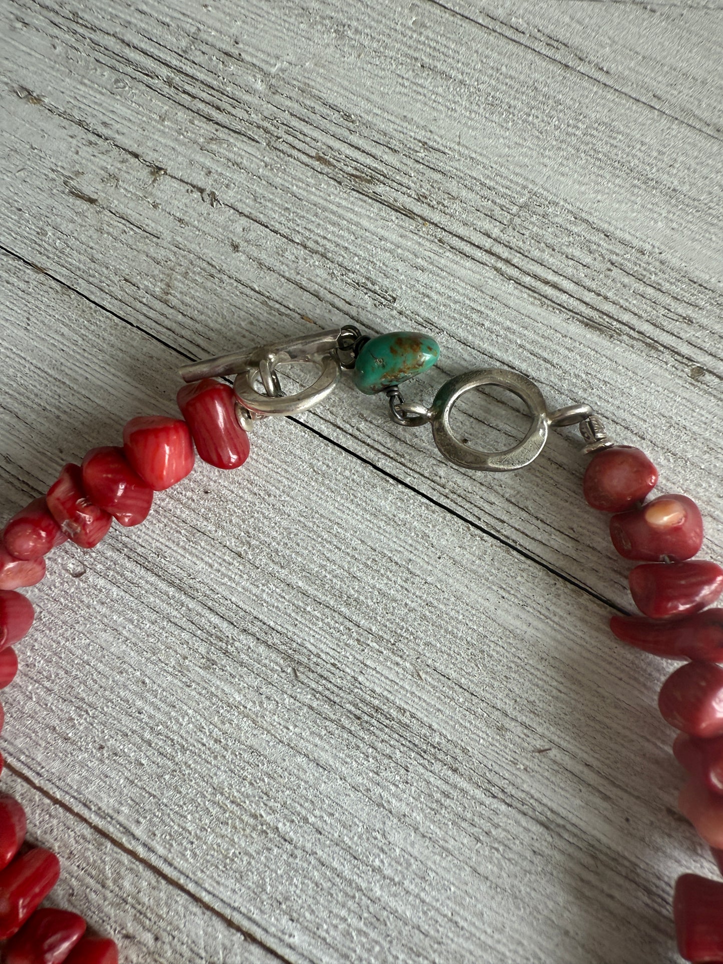 Tibetan cowrie shell pendant on coral necklace. 17.5-18.5”