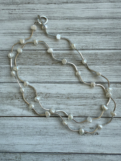 Long fine silver and pearl necklace. 35.75”