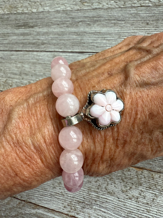 Carved Peruvian Opal flower charm on rose quartz stretch bracelet. 7.5”
