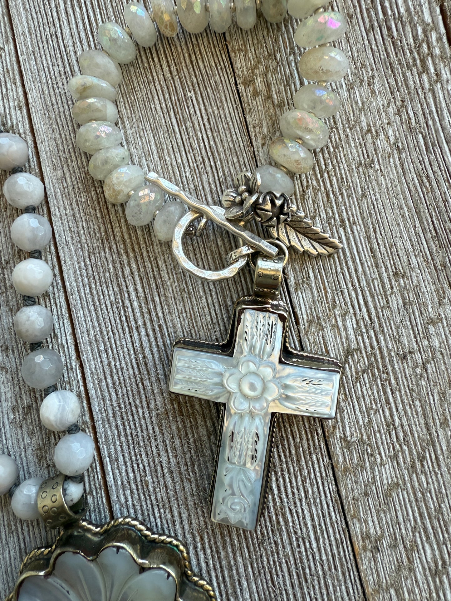 Mother of pearl carved cross on faceted moonstone short necklace. 18”