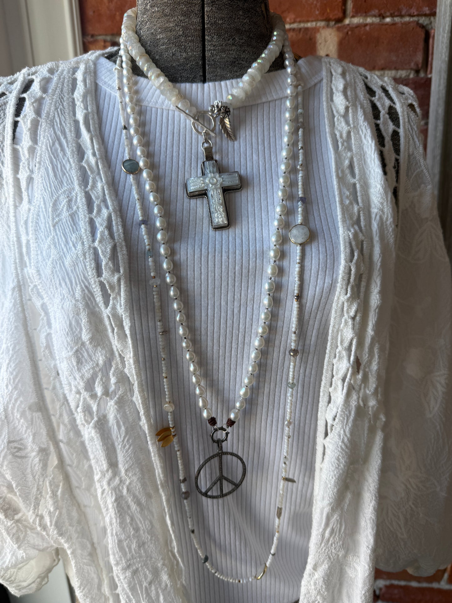 Mother of pearl carved cross on faceted moonstone short necklace. 18”