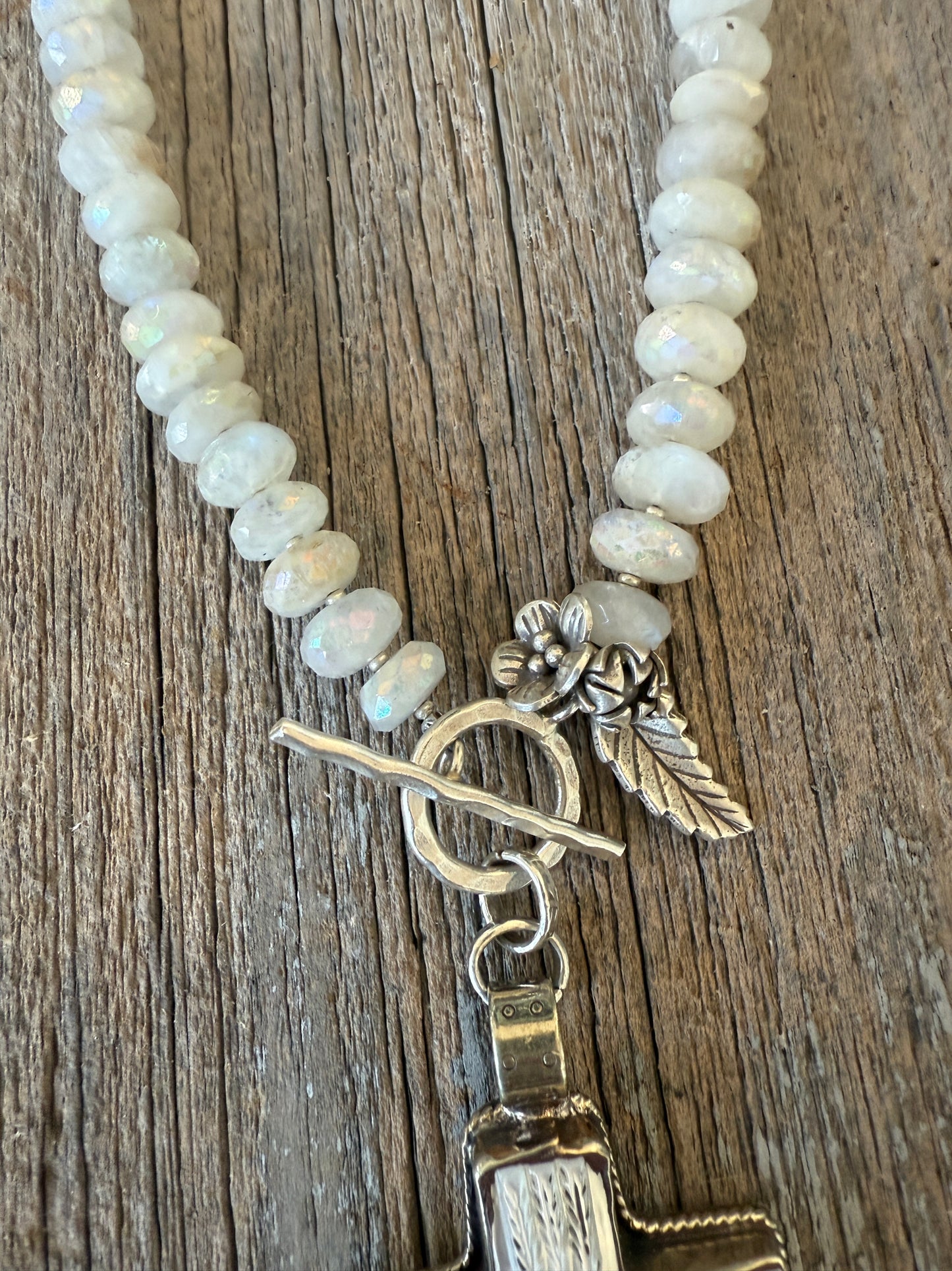 Mother of pearl carved cross on faceted moonstone short necklace. 18”