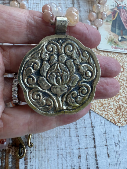 Hand carved pink Opal Tibetan rose pendant hand knotted onto cherry blossom agates necklace. 34” long.