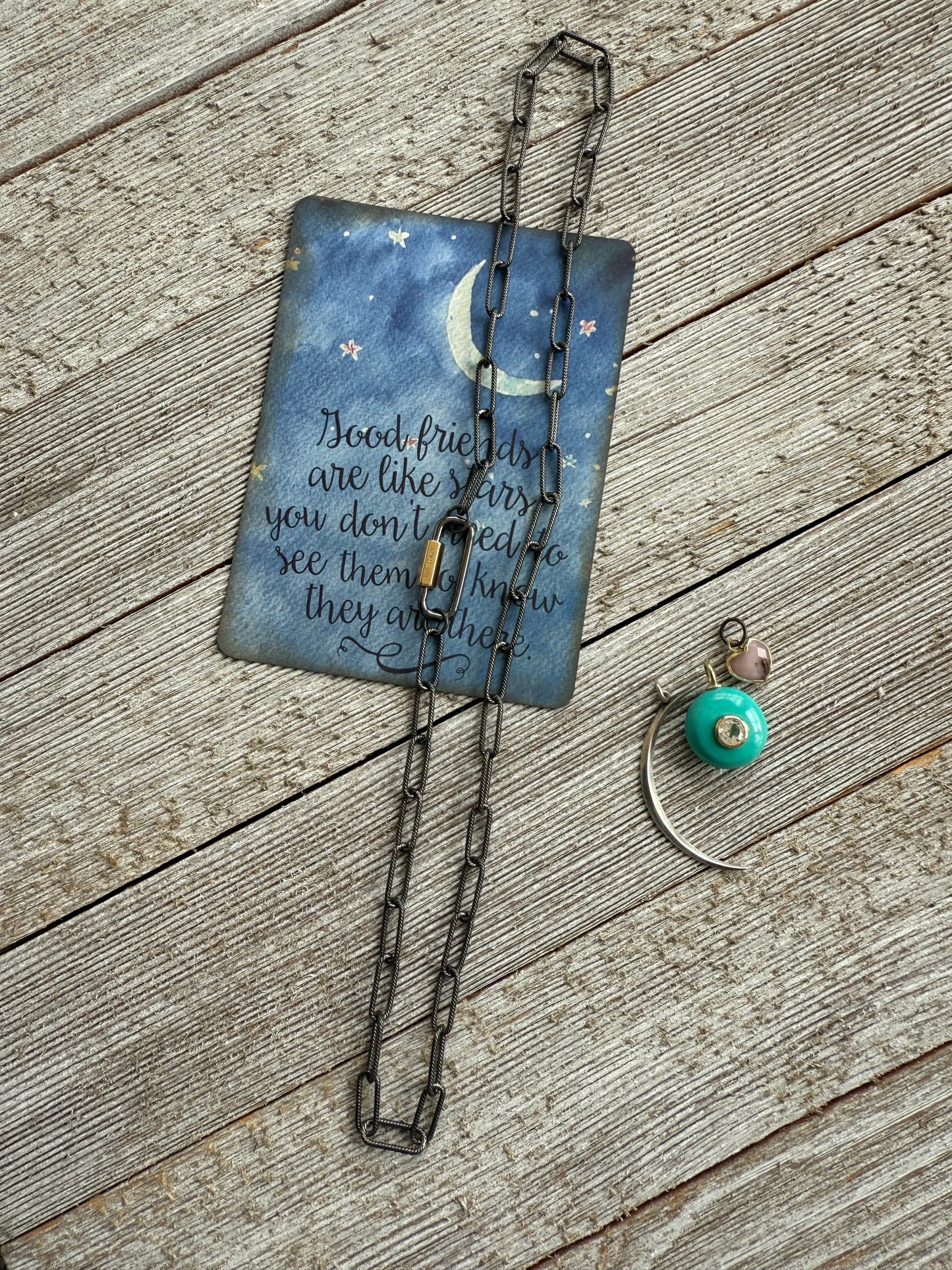 Rhodium sterling paperclip chain and carabiner clasp with turquoise and topaz, heart, and moon charms necklace.