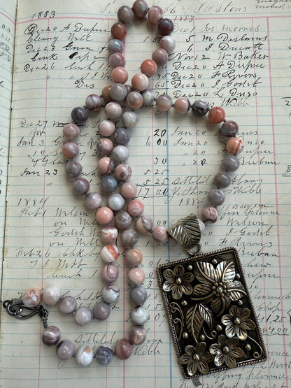 Hand knotted Botswana agates on silver flower pendant statement necklace.