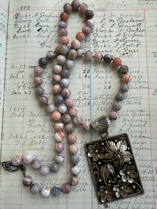Hand knotted Botswana agates on silver flower pendant statement necklace.