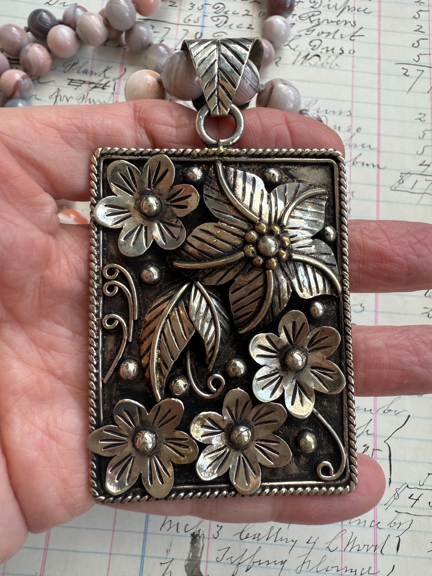 Hand knotted Botswana agates on silver flower pendant statement necklace.