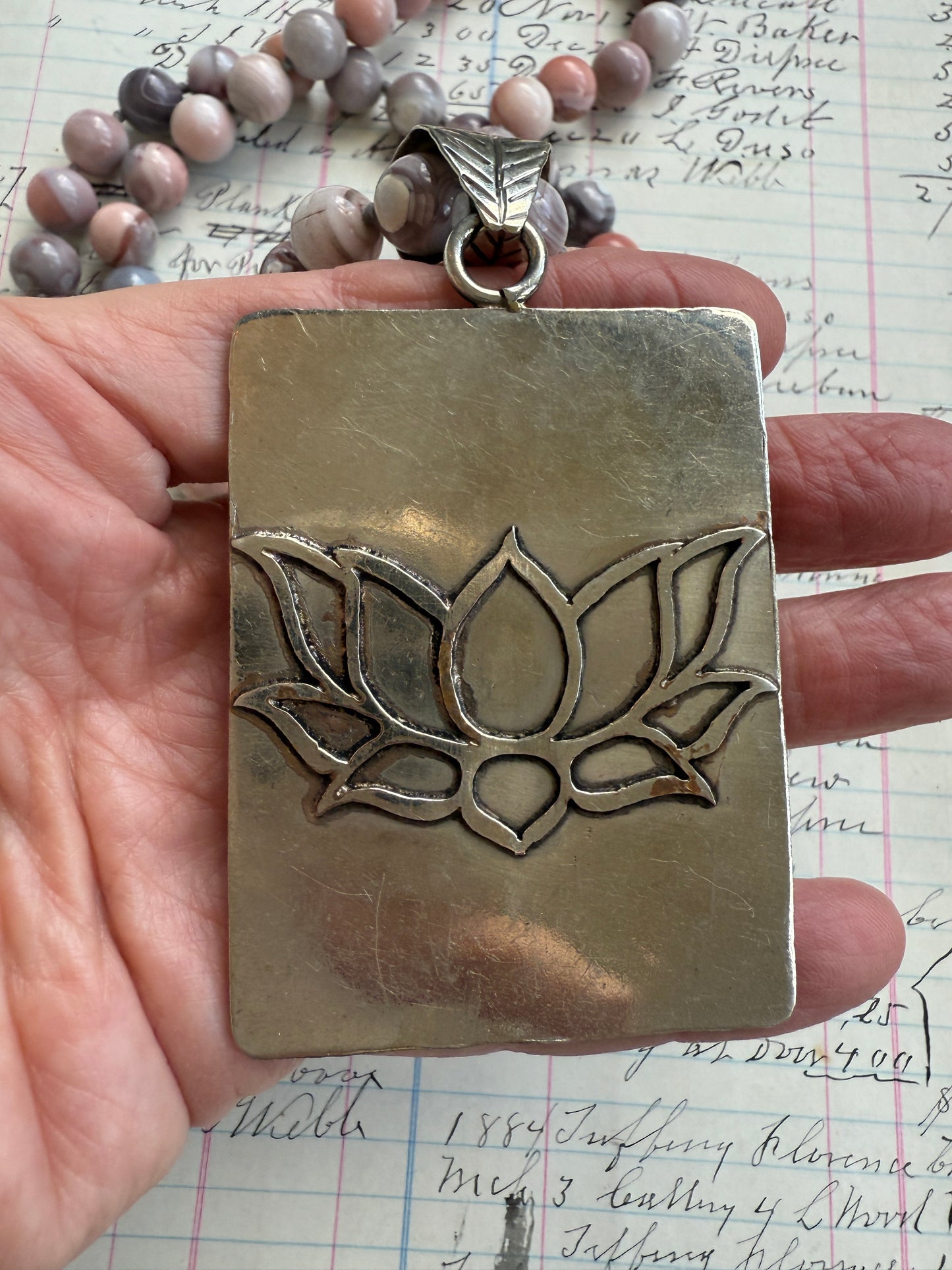 Hand knotted Botswana agates on silver flower pendant statement necklace.