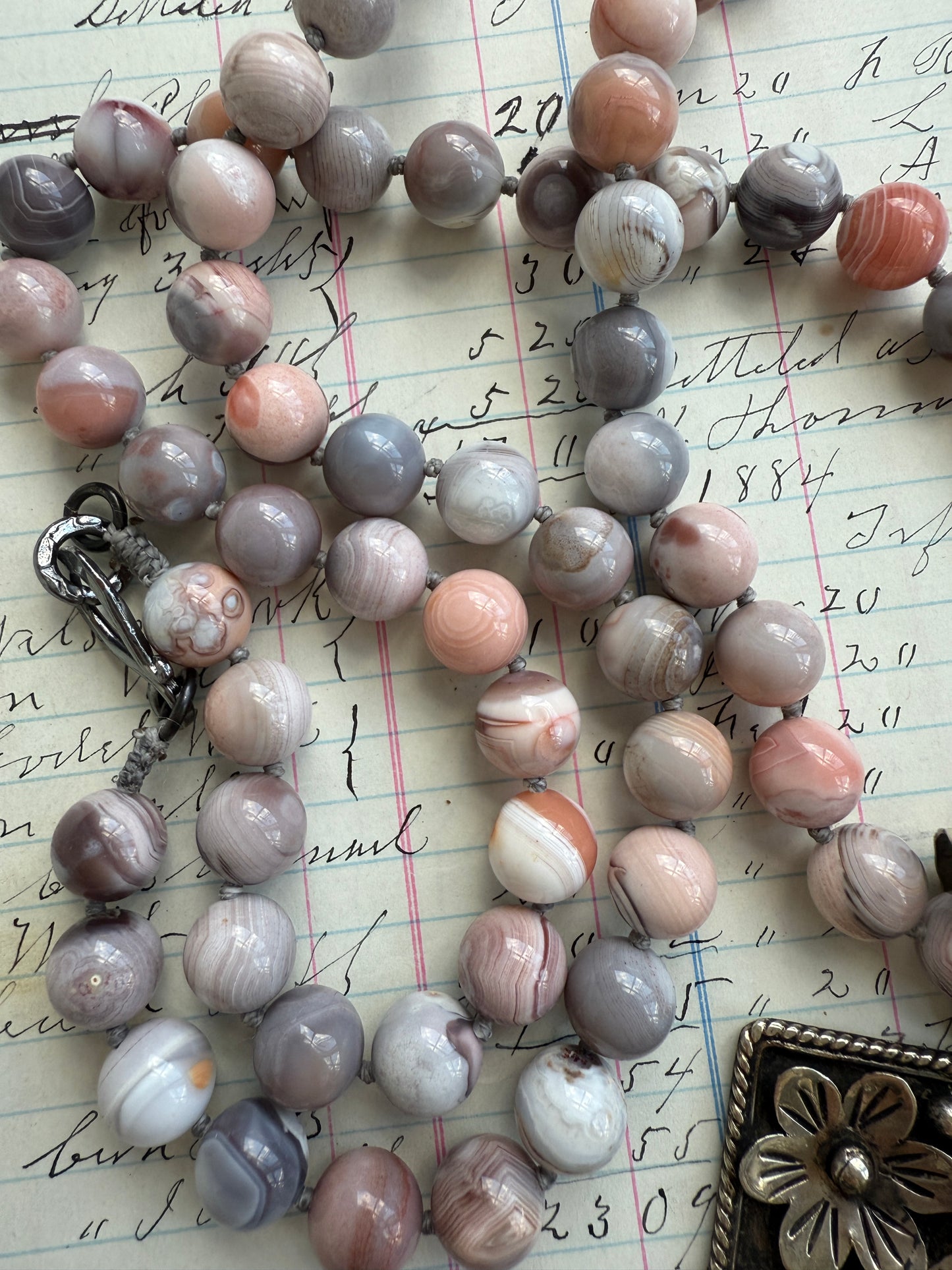 Hand knotted Botswana agates on silver flower pendant statement necklace.