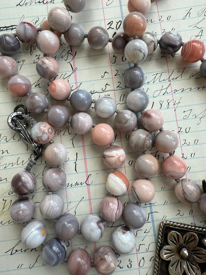 Hand knotted Botswana agates on silver flower pendant statement necklace.