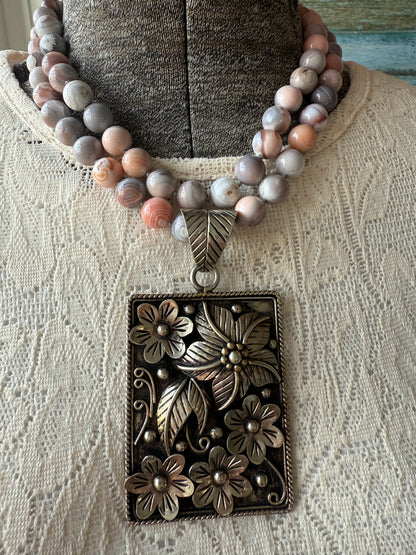 Hand knotted Botswana agates on silver flower pendant statement necklace.