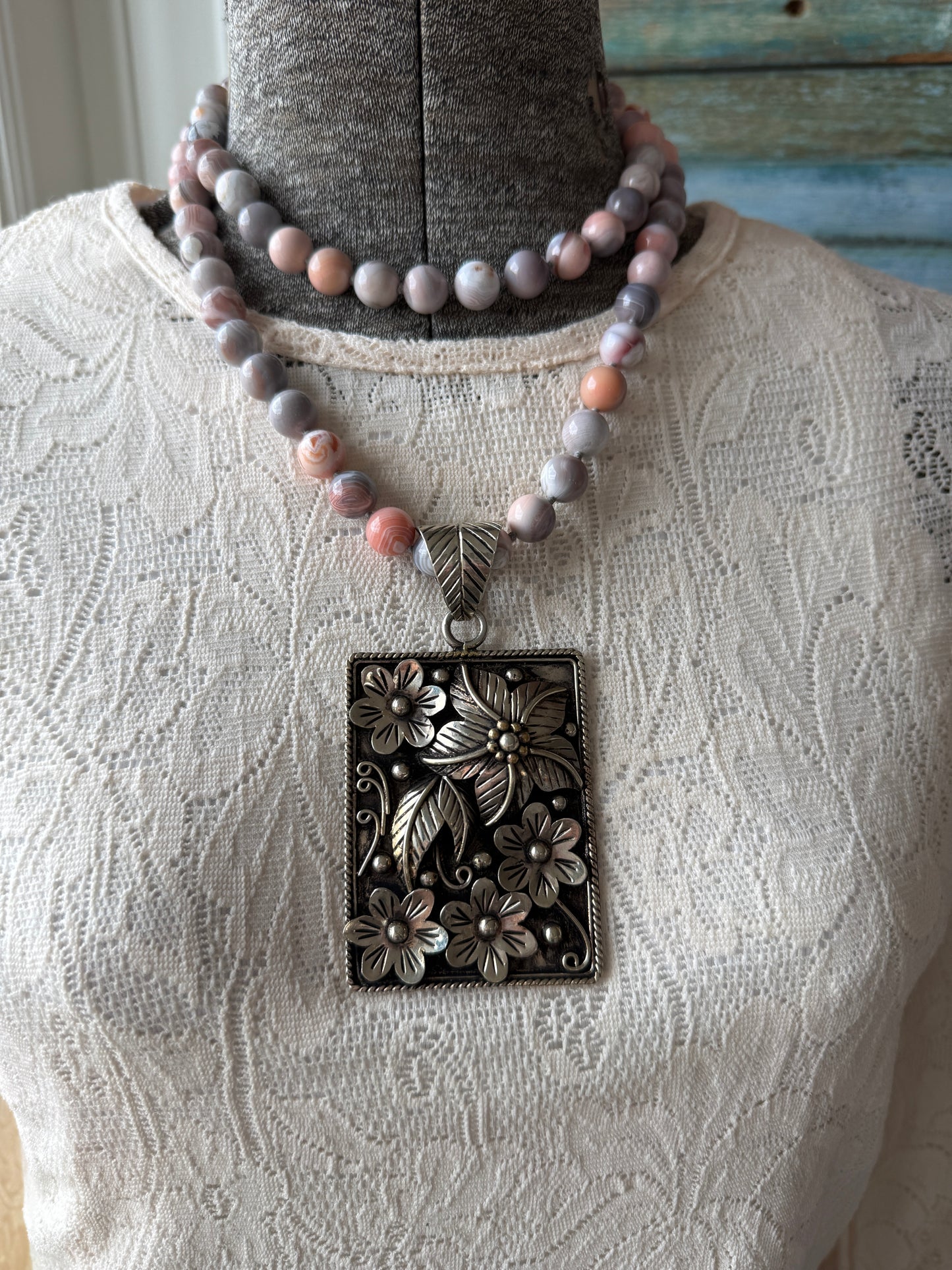 Hand knotted Botswana agates on silver flower pendant statement necklace.