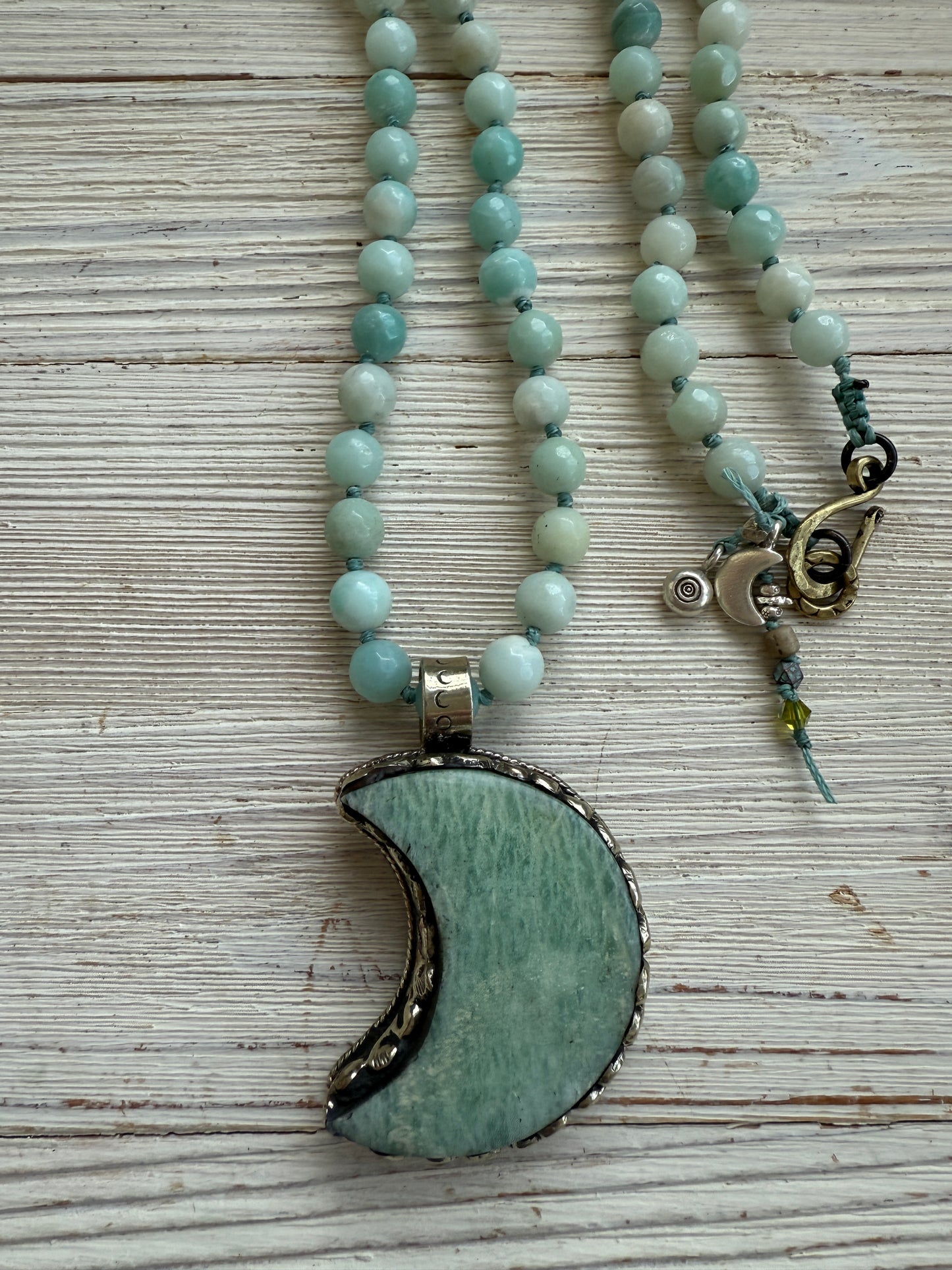 Tibetan amazonite crescent moon on knotted amazonite beads. 34”