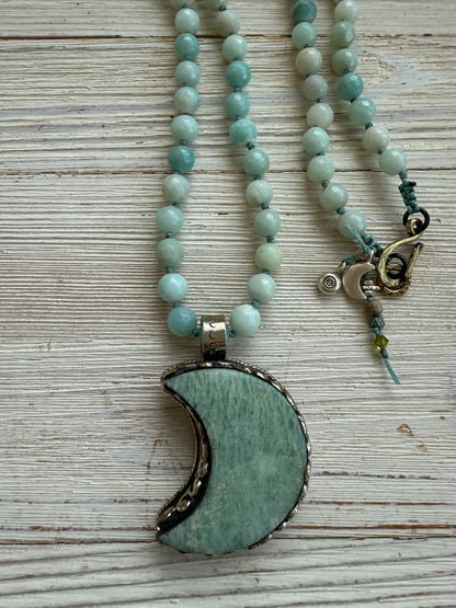 Tibetan amazonite crescent moon on knotted amazonite beads. 34”