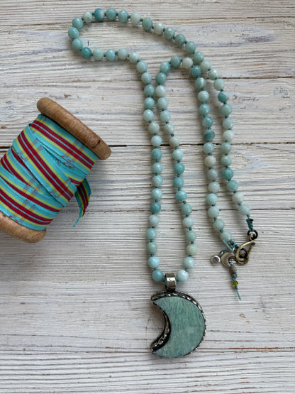 Tibetan amazonite crescent moon on knotted amazonite beads. 34”
