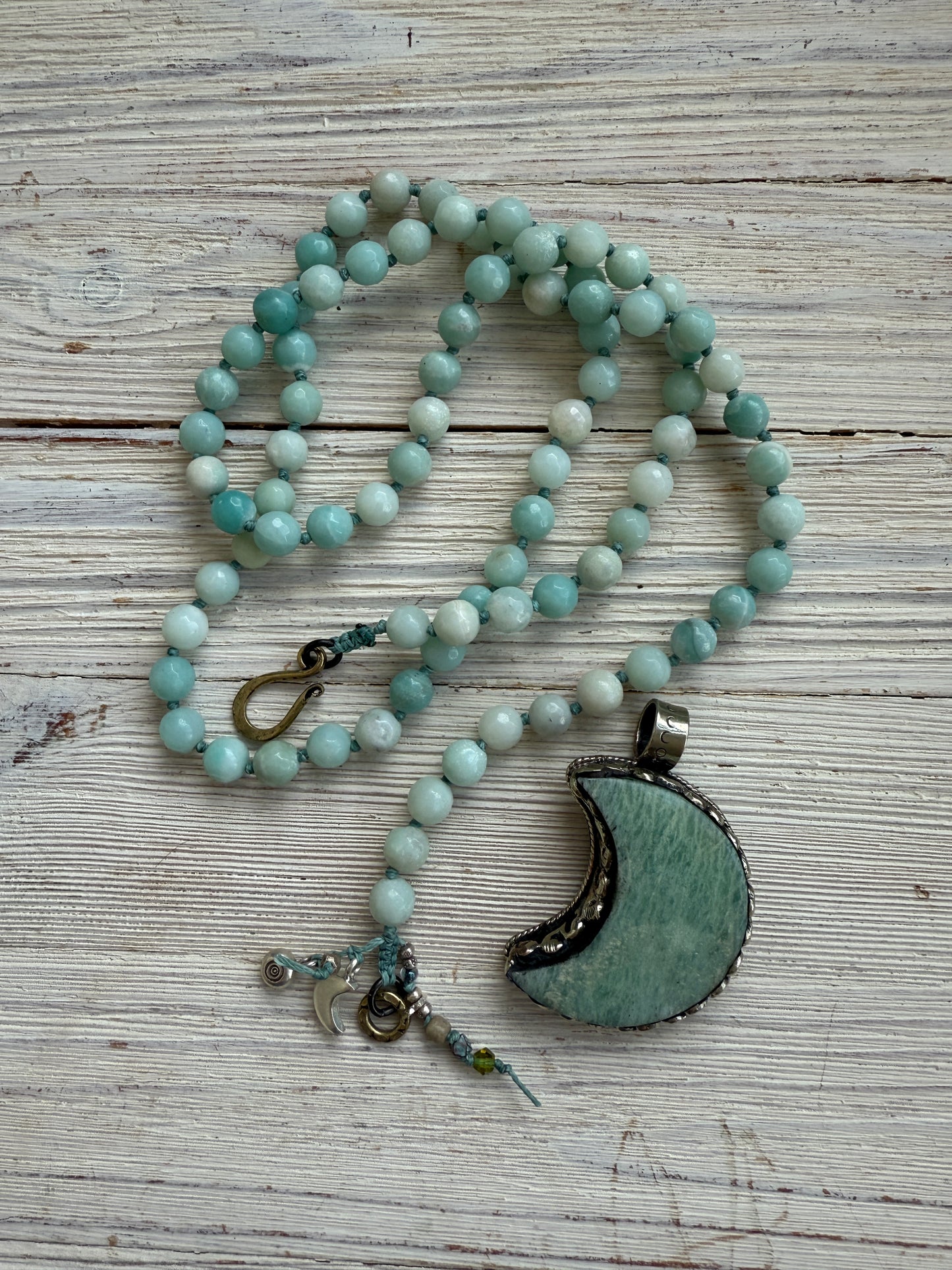 Tibetan amazonite crescent moon on knotted amazonite beads. 34”