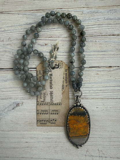 Tibetan bumblebee jasper pendant on knotted grey labradorite necklace. 33” long.