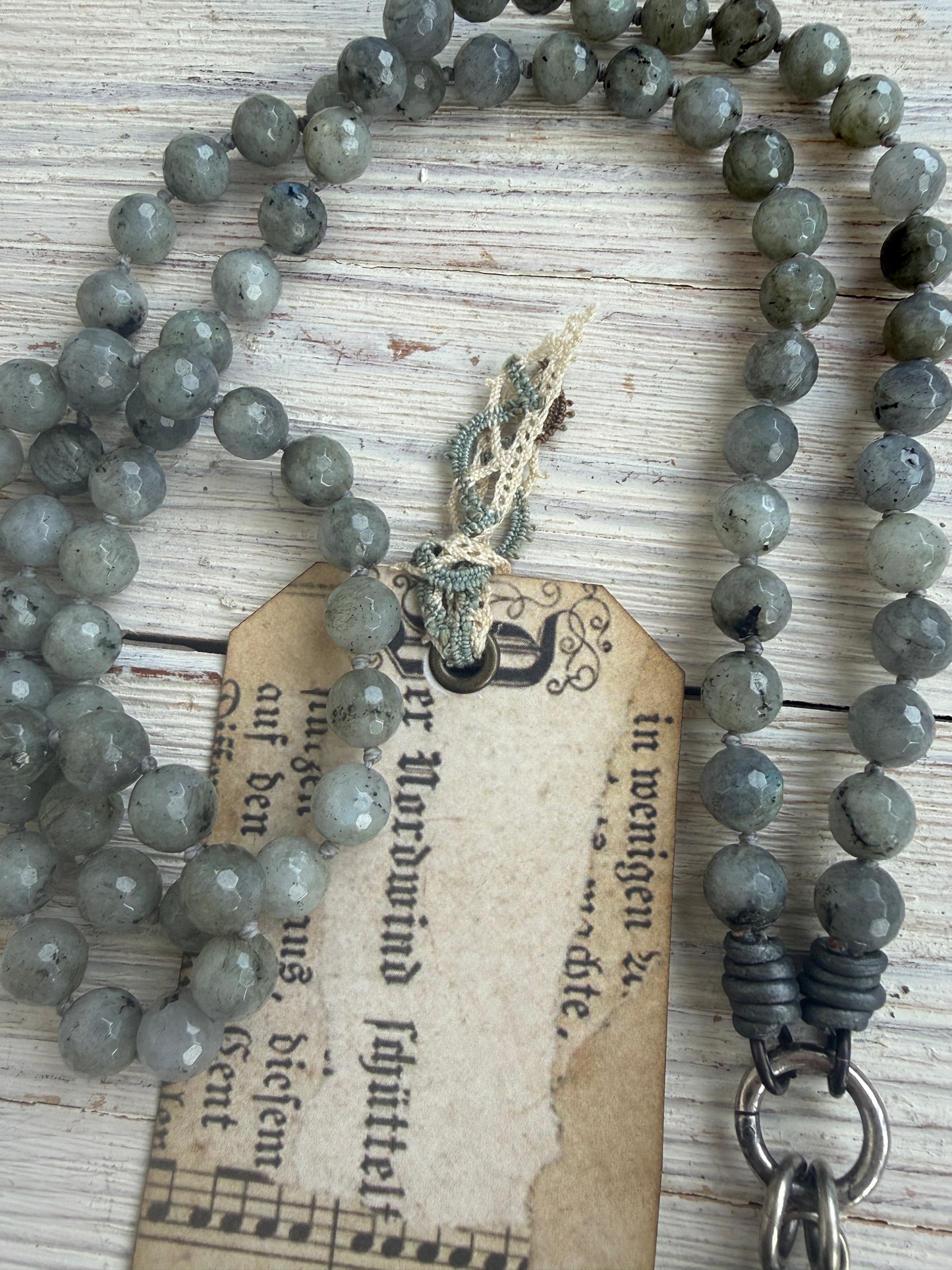 Tibetan bumblebee jasper pendant on knotted grey labradorite necklace. 33” long.