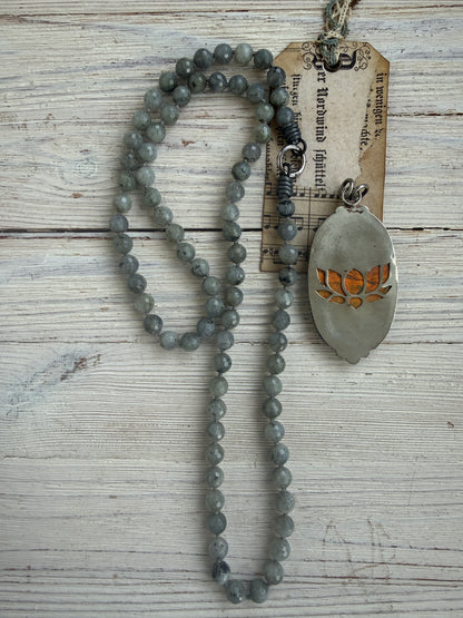 Tibetan bumblebee jasper pendant on knotted grey labradorite necklace. 33” long.