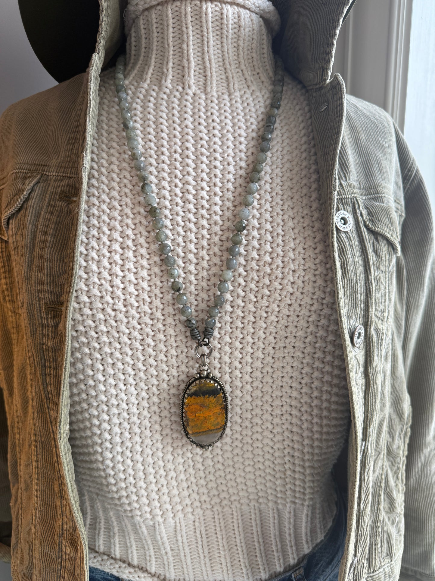 Tibetan bumblebee jasper pendant on knotted grey labradorite necklace. 33” long.