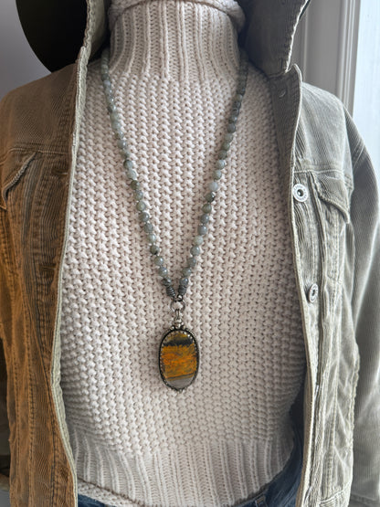 Tibetan bumblebee jasper pendant on knotted grey labradorite necklace. 33” long.