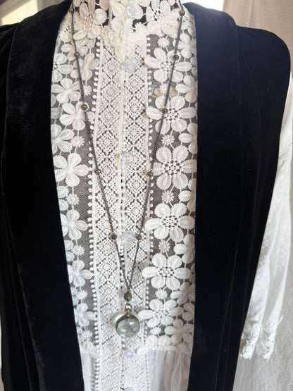 Antiqued bronze locket on sterling silver and pyrite chain. 32” necklace.