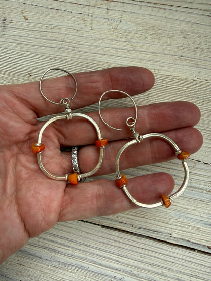 Segmented hoops of fine silver with broom coral accents earrings.