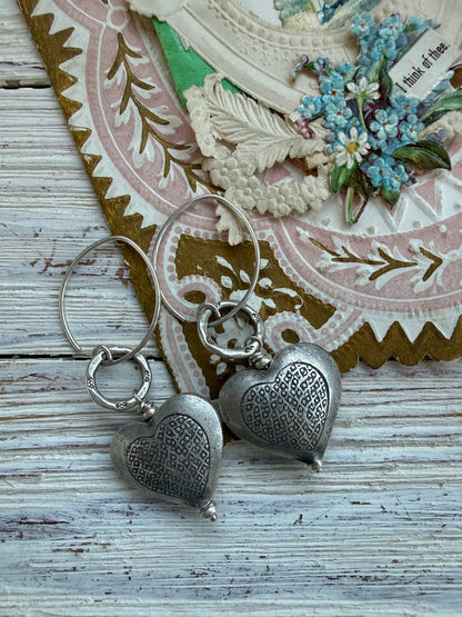 Textured fine silver heart earrings.