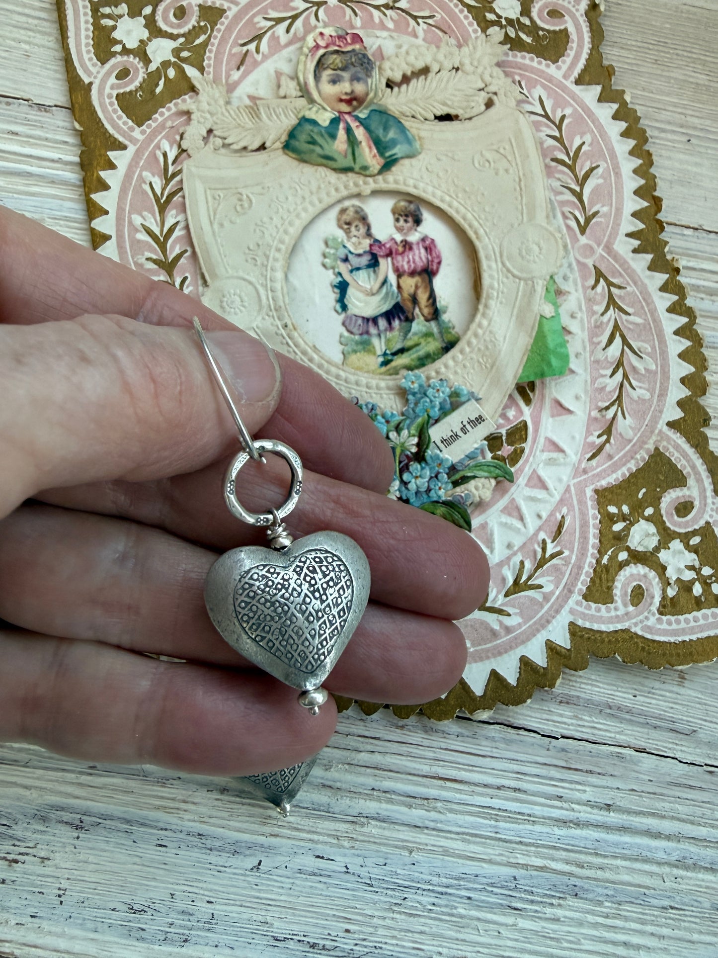 Textured fine silver heart earrings.