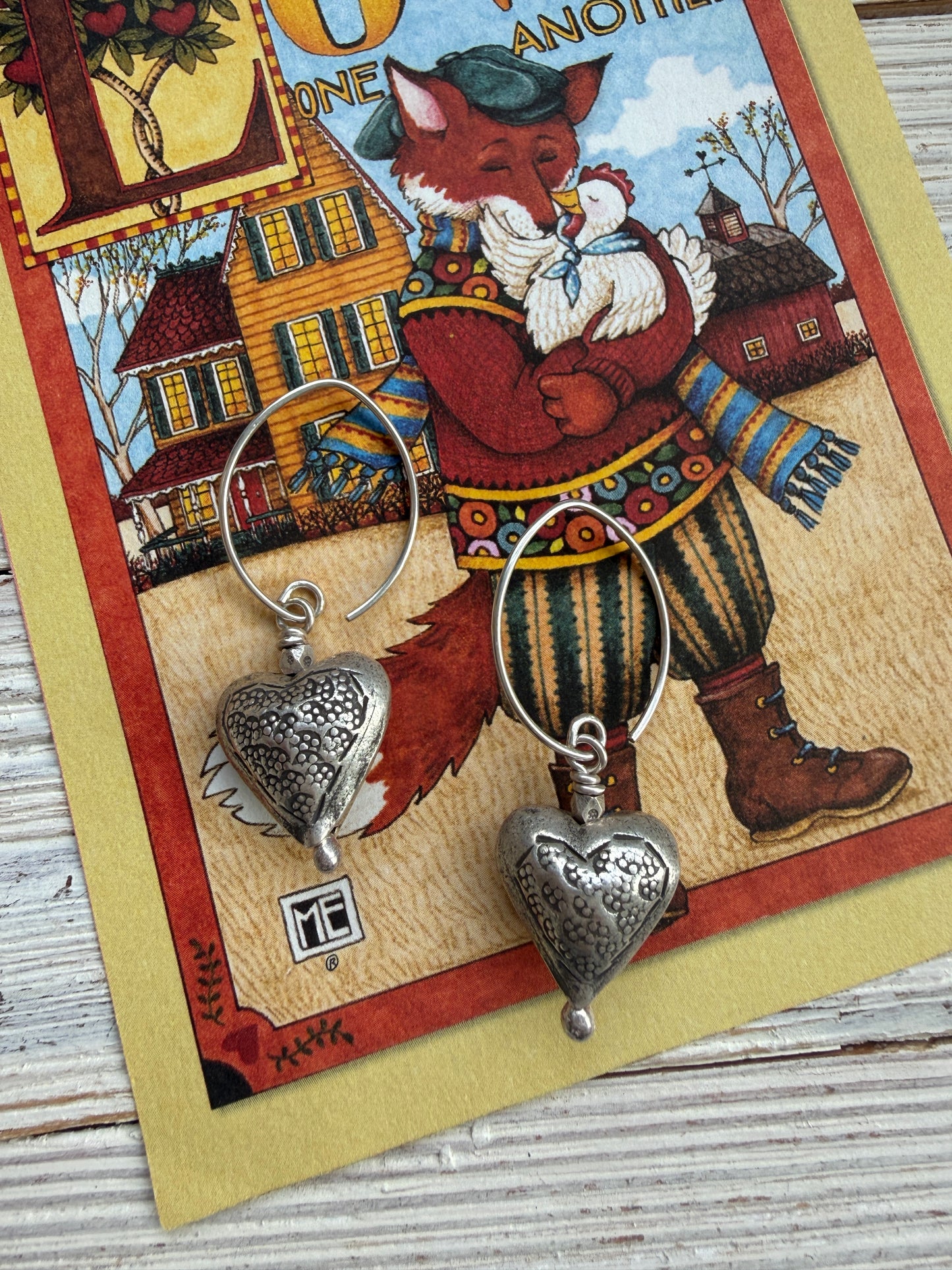 Stamped fine silver heart earrings.